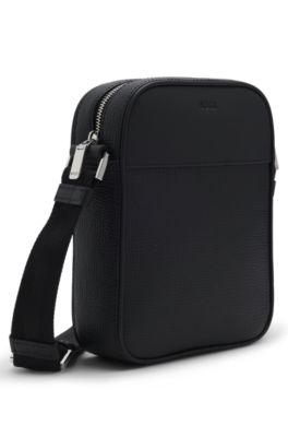 Reporter bag in textured and plain leather, Black