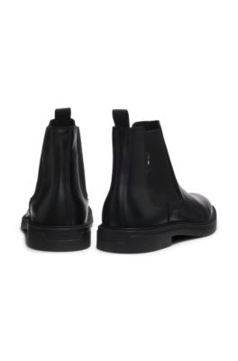 Bottines Chelsea en cuir lustr&eacute; avec surpiq&ucirc;re embl&eacute;matique, Noir
