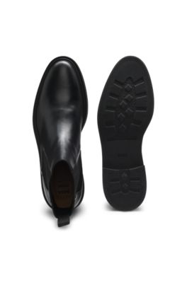 Bottines Chelsea en cuir lustr&eacute; avec surpiq&ucirc;re embl&eacute;matique, Noir