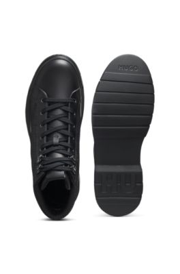 Botines con monograma y apliques de piel, Negro