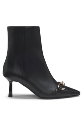 Botas de piel sint&eacute;tica con ribete met&aacute;lico y tac&oacute;n de 7&nbsp;cm, Negro