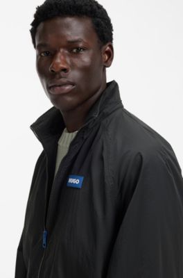 Veste coupe-vent d&eacute;perlante &agrave; capuche amovible, Noir
