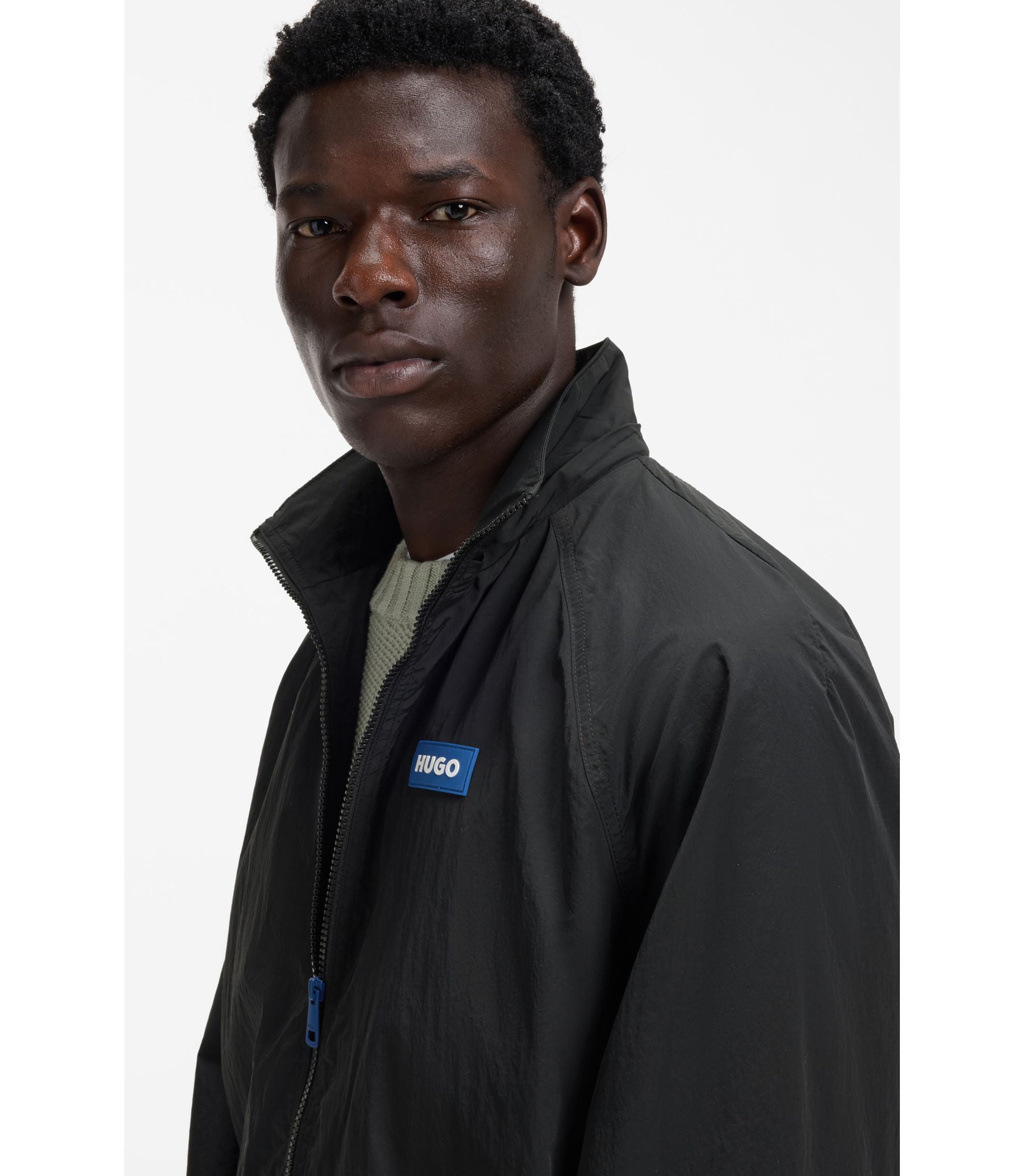 HUGO - Logo-patch windbreaker with water-repellent finish - Black