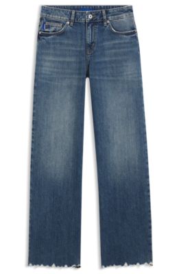 Jeans loose fit en denim azul con bajos deshilachados, Azul