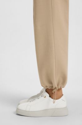 Baskets en cuir avec semelle int&eacute;rieure compens&eacute;e, Blanc