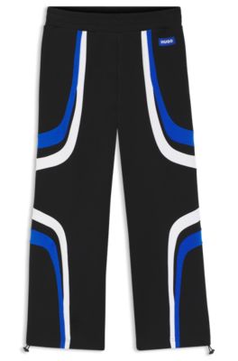 Stretch-cotton tracksuit bottoms with colourful panelling, Black
