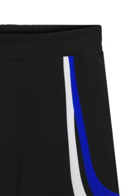 Stretch-cotton tracksuit bottoms with colourful panelling, Black