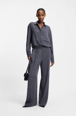Pantalones relaxed fit con logos apilados, Fantas&iacute;a