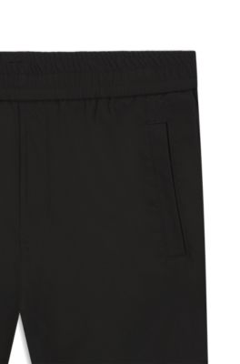 Pantalones straight fit de tejido antidesgarros repelente al agua, Negro
