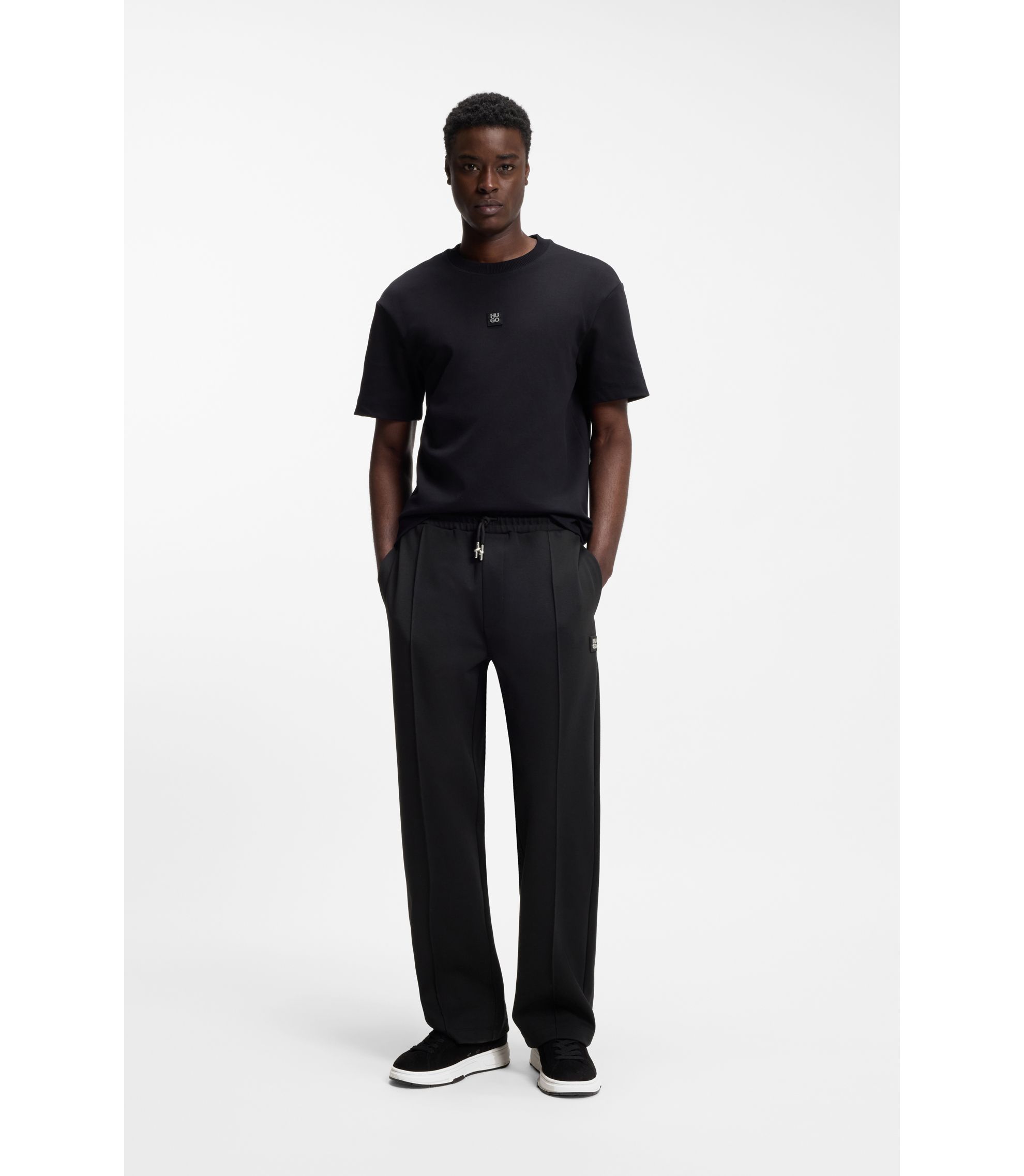 HUGO - Pintuck-pleat tracksuit bottoms in a relaxed fit - Black