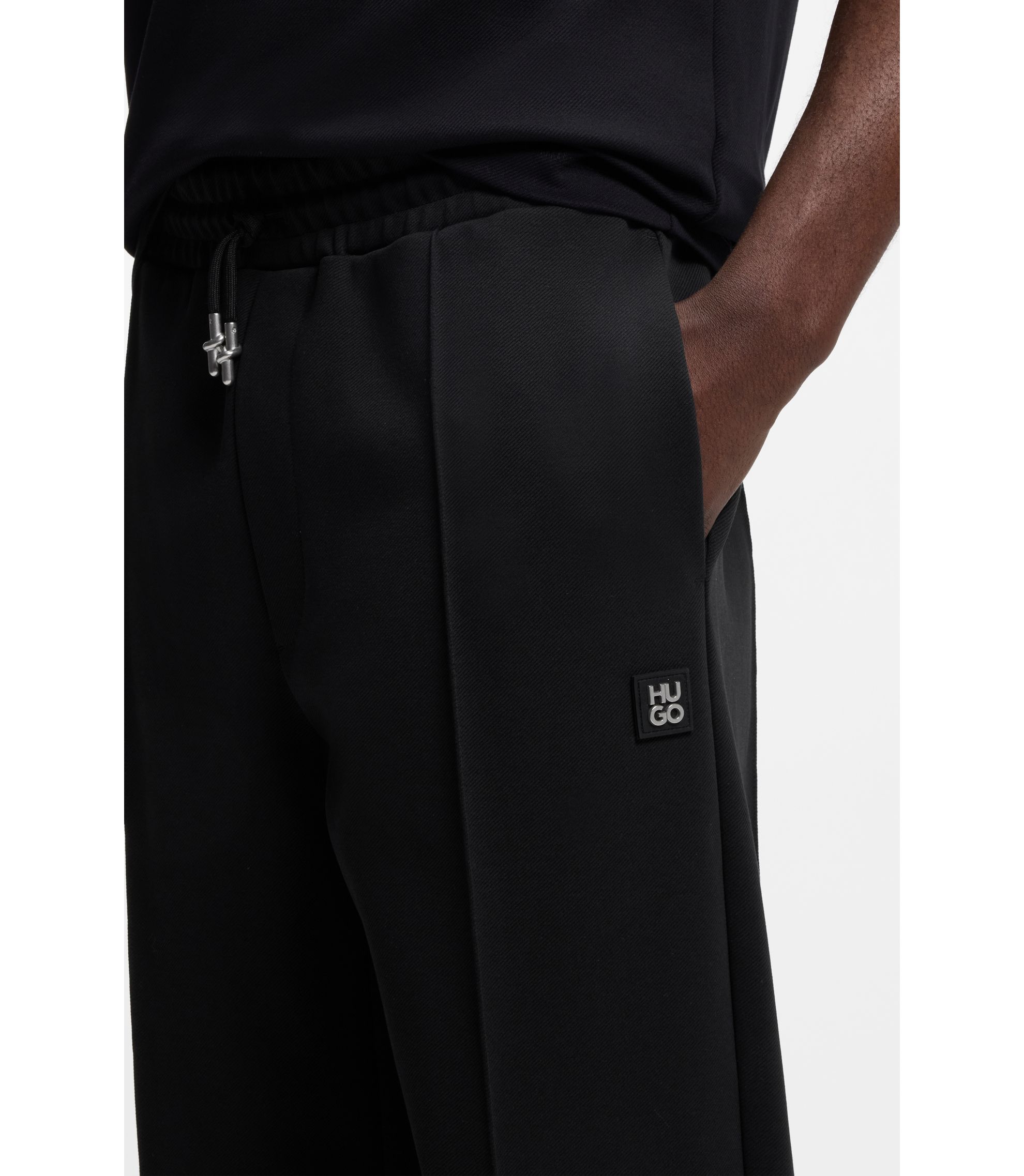 HUGO - Pintuck-pleat tracksuit bottoms in a relaxed fit - Black