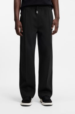 Pintuck-pleat tracksuit bottoms in a relaxed fit, Black