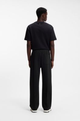 Pantalones de ch&aacute;ndal relaxed fit con pinzas, Negro