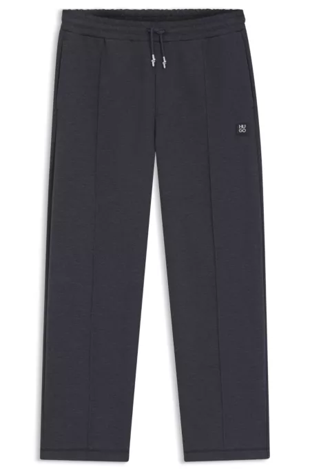 Pintuck-pleat tracksuit bottoms in a relaxed fit