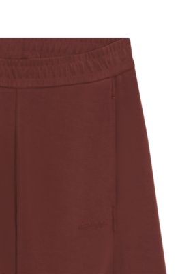 Pantalones de ch&aacute;ndal balloon fit con logo bordado, Rojo oscuro
