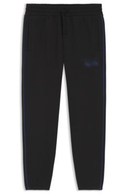 Pantalones de ch&aacute;ndal en felpa de algod&oacute;n con logo y pespuntes en contraste, Negro