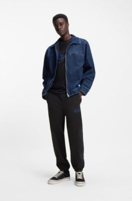 Pantalones de ch&aacute;ndal en felpa de algod&oacute;n con logo y pespuntes en contraste, Negro