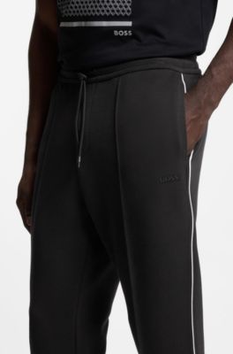 Pantalones de ch&aacute;ndal de algod&oacute;n con detalles de ribete, Negro