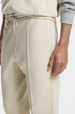 Pantalones de ch&aacute;ndal de algod&oacute;n con detalles de ribete, Beige claro