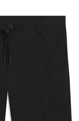 Pantalones de corte moderno en tejido otomano el&aacute;stico t&eacute;cnico, Negro