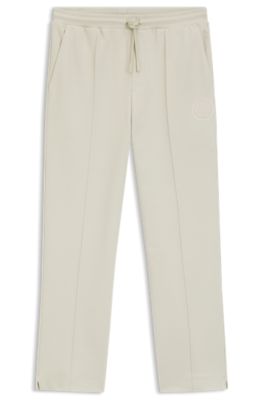 Cotton-blend tracksuit bottoms with tennis-themed logo, Light Beige