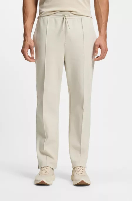 Cotton-blend tracksuit bottoms with tennis-themed logo