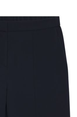Pantalones relaxed fit en crep&eacute; resistente a las arrugas, Azul oscuro