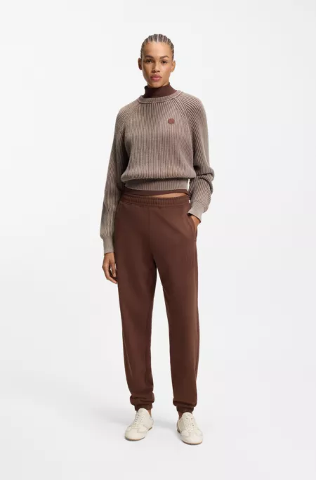 Logo-artwork tracksuit bottoms in cotton terry