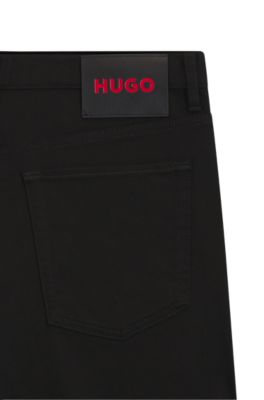 Jeans tapered fit de denim el&aacute;stico Stay Black, Negro