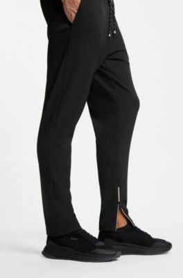 Stretch-gabardine tracksuit bottoms with zipped hems, Black
