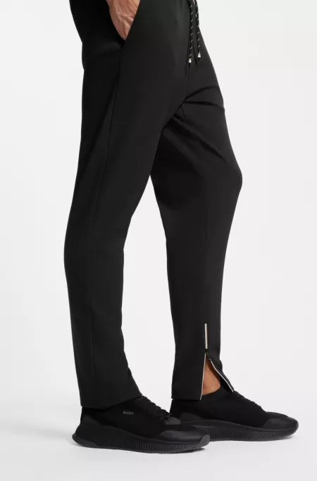Stretch-gabardine tracksuit bottoms with zipped hems