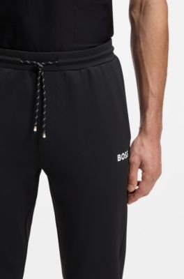 Stretch-gabardine tracksuit bottoms with zipped hems, Black