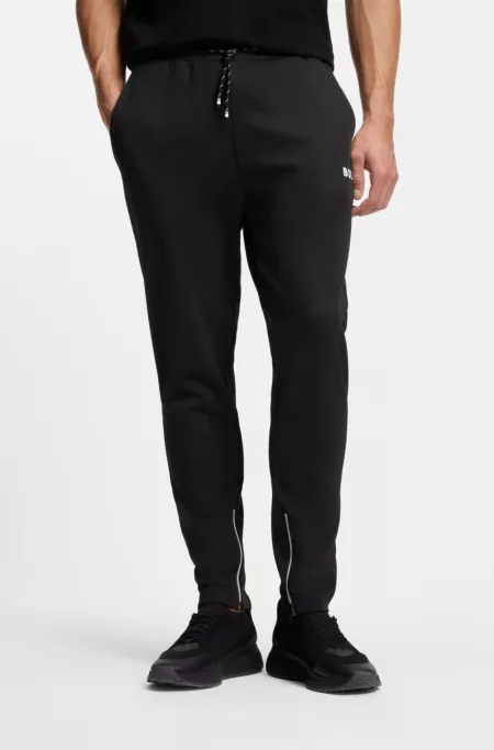 Stretch-gabardine tracksuit bottoms with zipped hems