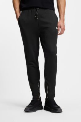 Stretch-gabardine tracksuit bottoms with zipped hems, Black