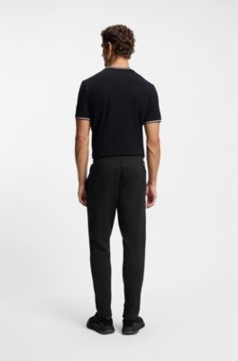 Stretch-gabardine tracksuit bottoms with zipped hems, Black