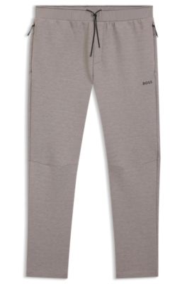Pantalones de ch&aacute;ndal regular fit con detalles reflectantes, Gris claro