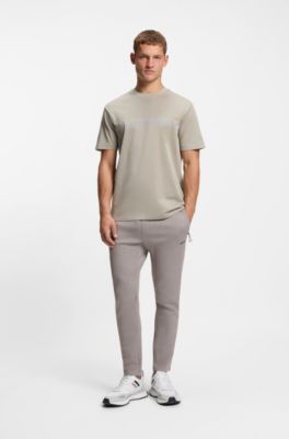 Pantalones de ch&aacute;ndal regular fit con detalles reflectantes, Gris claro