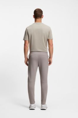 Pantalones de ch&aacute;ndal regular fit con detalles reflectantes, Gris claro