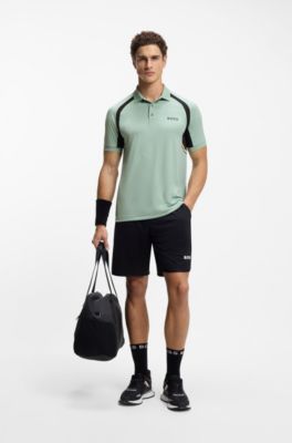 Active Polo slim fit en tejido el&aacute;stico de secado r&aacute;pido, Cal