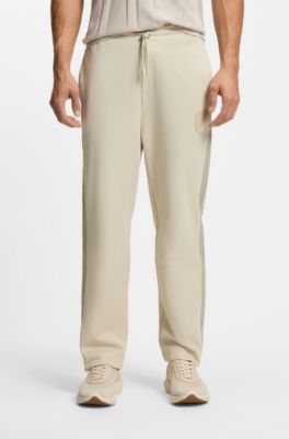 Crest-logo tracksuit bottoms in a regular fit, Light Beige