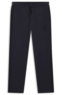 Pantalones de ch&aacute;ndal regular fit con escudo con logo, Azul oscuro
