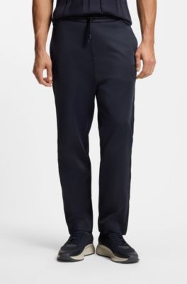 Pantalones de ch&aacute;ndal regular fit con escudo con logo, Azul oscuro
