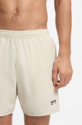 Swim shorts with logo print and signature-stripe details, White