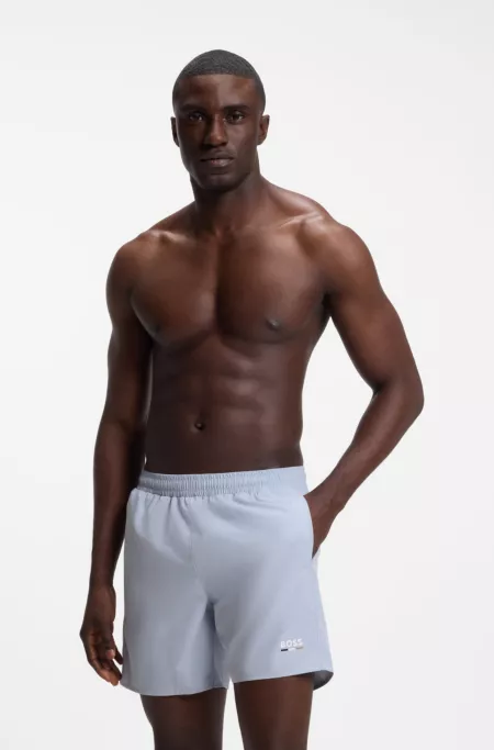 Swim shorts with logo print and signature-stripe details