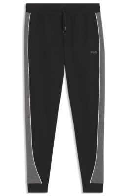 Pantalones de ch&aacute;ndal de piqu&eacute; de algod&oacute;n con ribetes en contraste, Negro