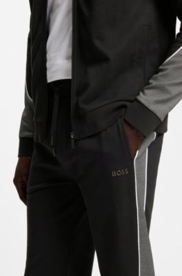 Pantalones de ch&aacute;ndal de piqu&eacute; de algod&oacute;n con ribetes en contraste, Negro