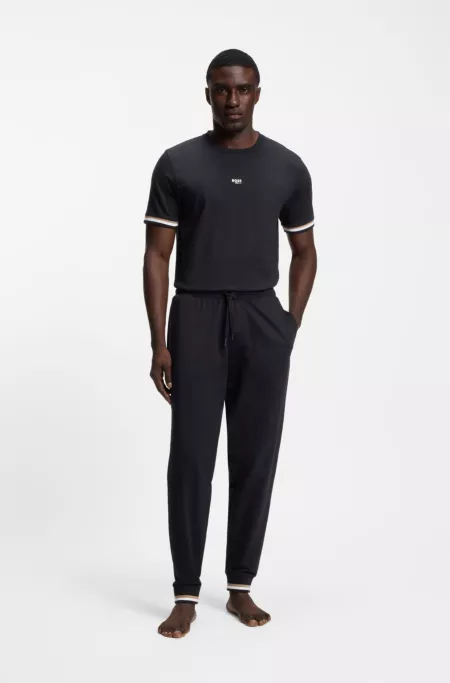Cotton-terry tracksuit bottoms with signature stripes and logo