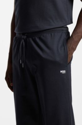 Pantalones de ch&aacute;ndal en felpa de algod&oacute;n con logo y rayas de la marca, Negro