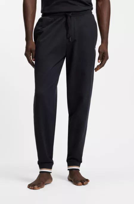 Cotton-terry tracksuit bottoms with signature stripes and logo