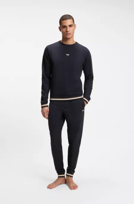 Cotton-terry tracksuit bottoms with signature stripes and logo